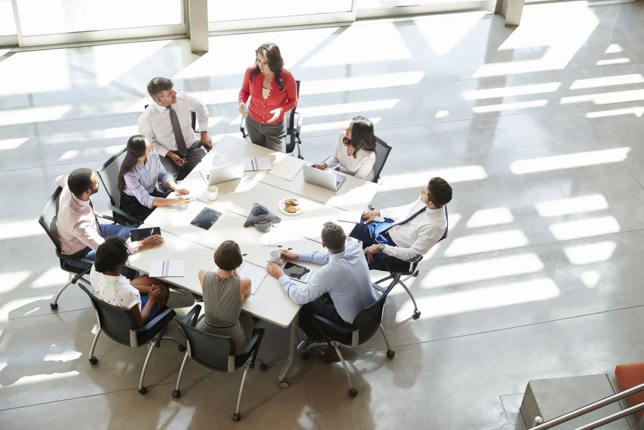A leadership team working around a conference table